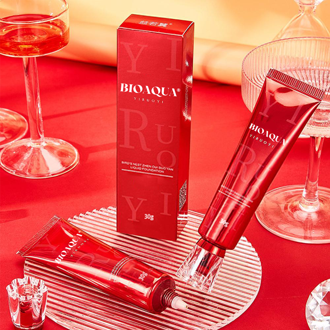 “Luxury liquid foundation in red packaging applied to skin, showcasing a smooth, radiant and natural-looking finish for medium skin tone, with a flawless lightweight coverage effect in a premium beauty setting.”
